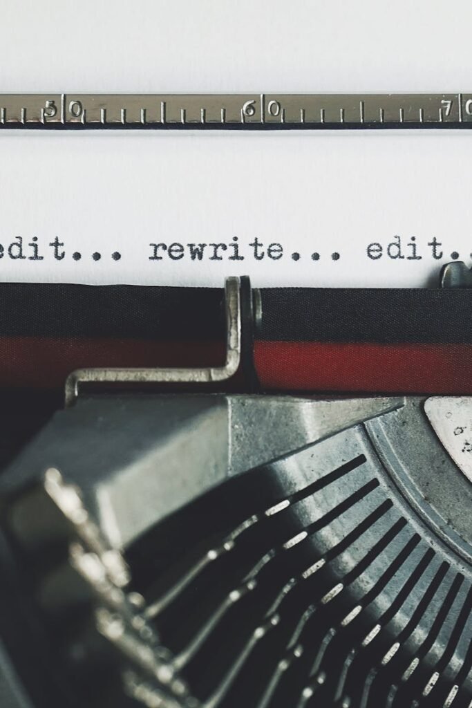 pexels-photo-3631711-3631711 Classic typewriter with text 'rewrite... edit...' on paper.
