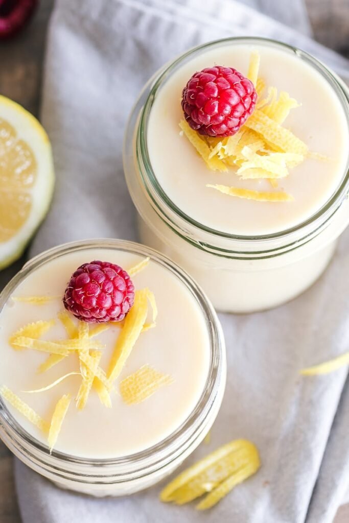 pexels-photo-3026801-3026801 Fresh lemon raspberry yogurt in mason jars, perfect for a refreshing dessert.