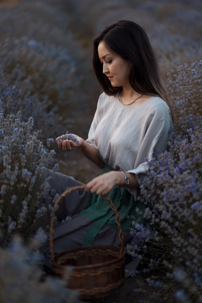 pexels-photo-18978389-18978389 Young woman with black hair picking lavender in Safranbolu, capturing serene rural beauty.